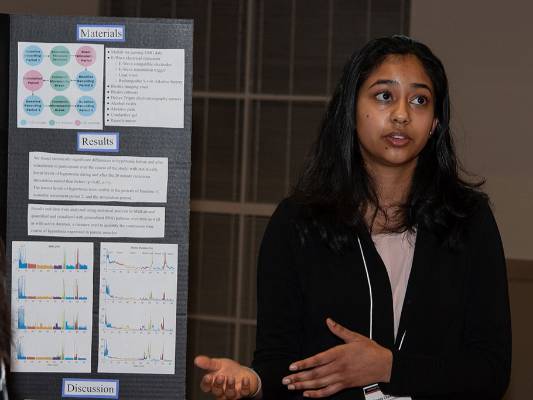 female student presenting her research