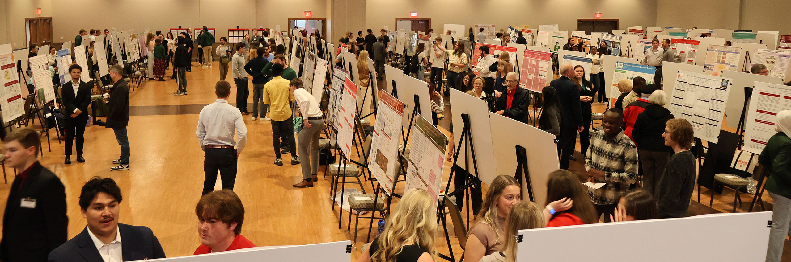 Students display their work on the Research Symposium